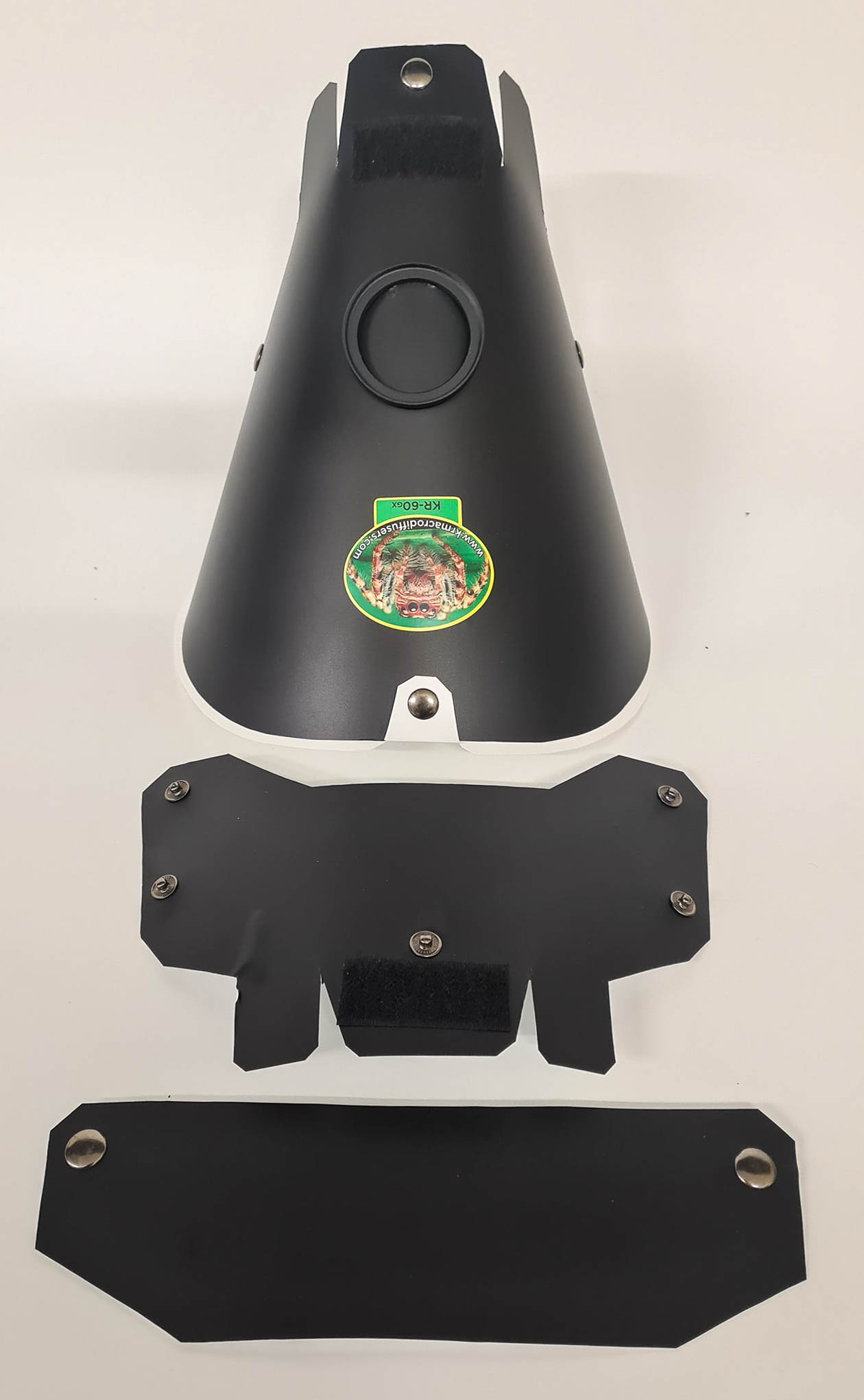 Top of matte black KR-60GX showing diffuser, extender, and dress panel.